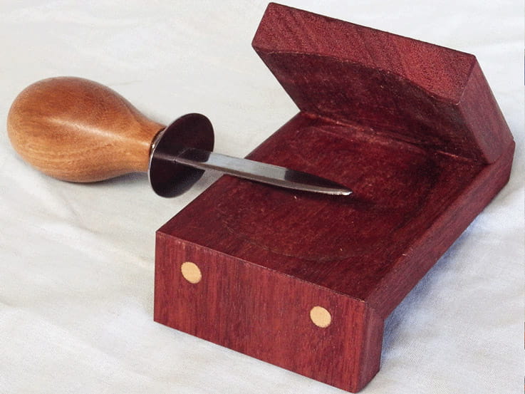 This beautiful hand crafted oyster holder and shucker is a great gift