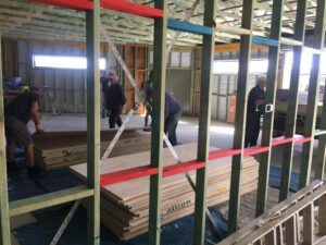 Unloading the plywood boards for the walls